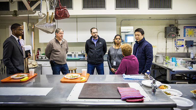 The Detroit Service Corps team speaks with Shirley Cockrell, who oversees Southwest Solutions’ Go-Getters Drop-in Center.