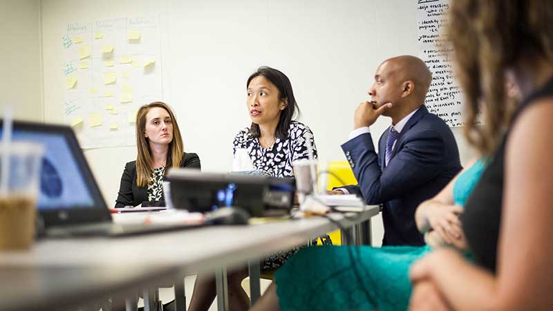 JPMorgan Service Corps members meet with EMPLOY leaders. JPMorgan Service Corps members meet with EMPLOY leaders.