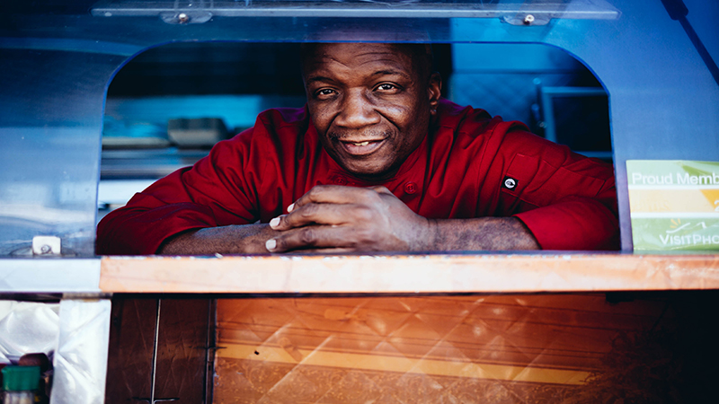Jamburrito Chef Michael Brown of looks out of the window in his food truck awaiting Phoenix Food Truck Friday customers