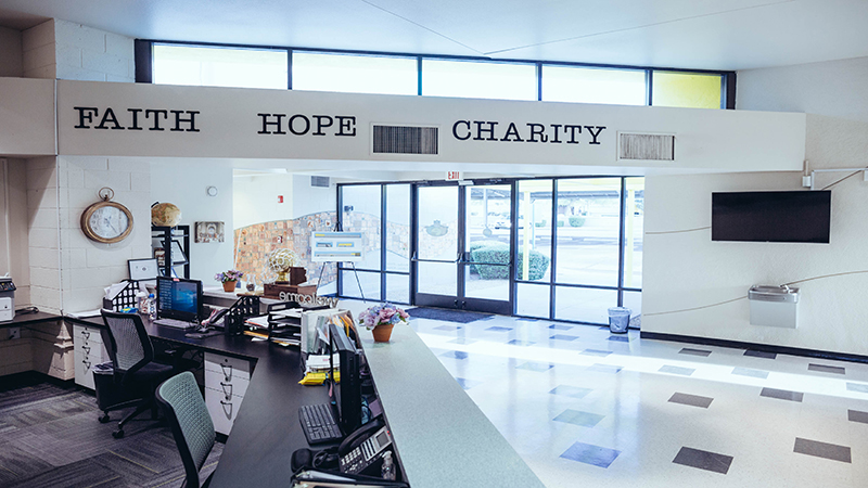 The YMCA slogan, “Faith, hope charity”, is still proudly displayed in the NLF YET College Prep lobby, reminding visitors and students of the building’s original purpose. 