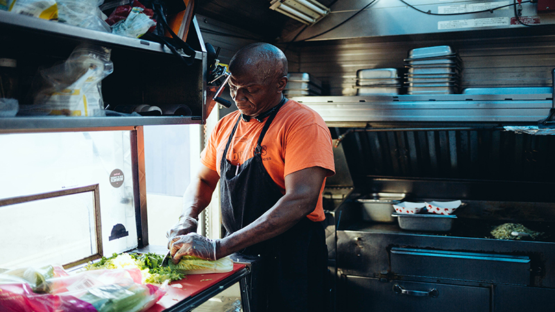 Chef Michael Brown prepares locally-renowned jambalaya burrito for a 400-person event